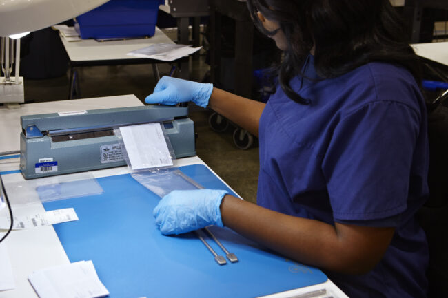 image of a person working on packaging and labeling