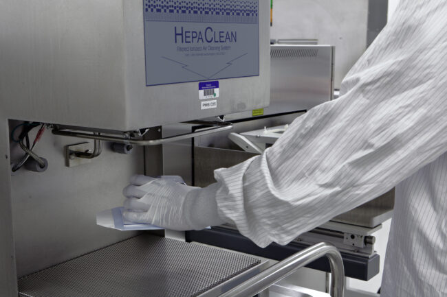 image of a person using a cleaning system in a cleanroom