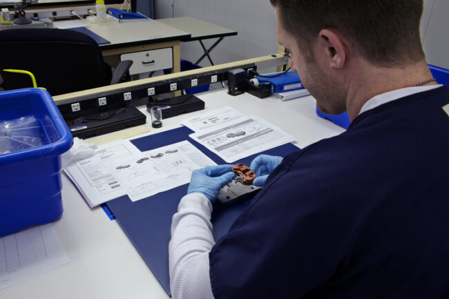 image of a man working on innovating a medical device