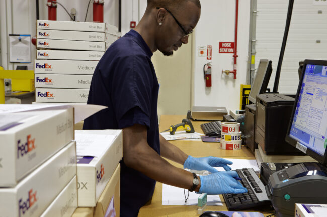image of a person working on a computer in logistics 3