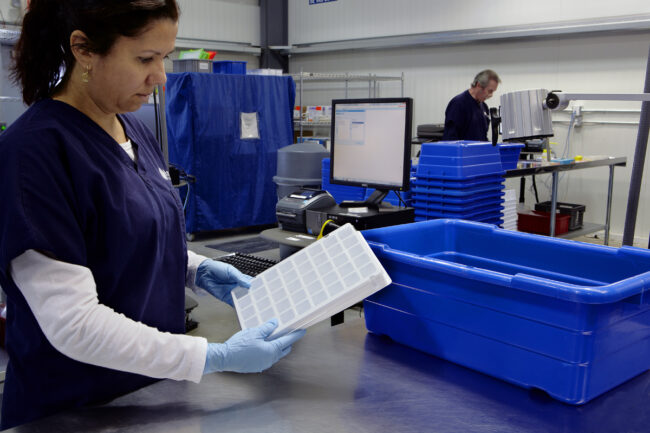 image of a person working at a station in logistics