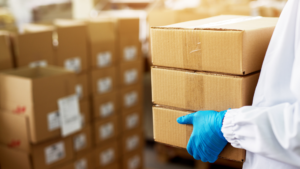 Workers in a warehouse processing returned medical devices for reverse logistics