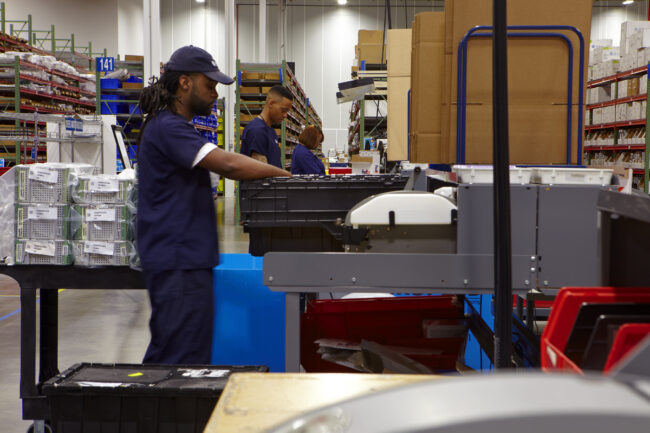 image of three people working in logistics