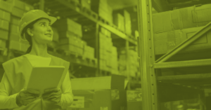 Logistics staff reviewing inventory in warehouse
