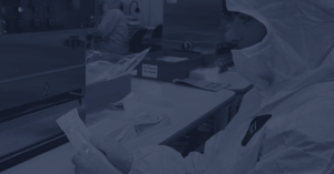 Lab technician is Streamlining the handling of Device Packaging in a clean room environment to Get Ahead of Regulatory Demands