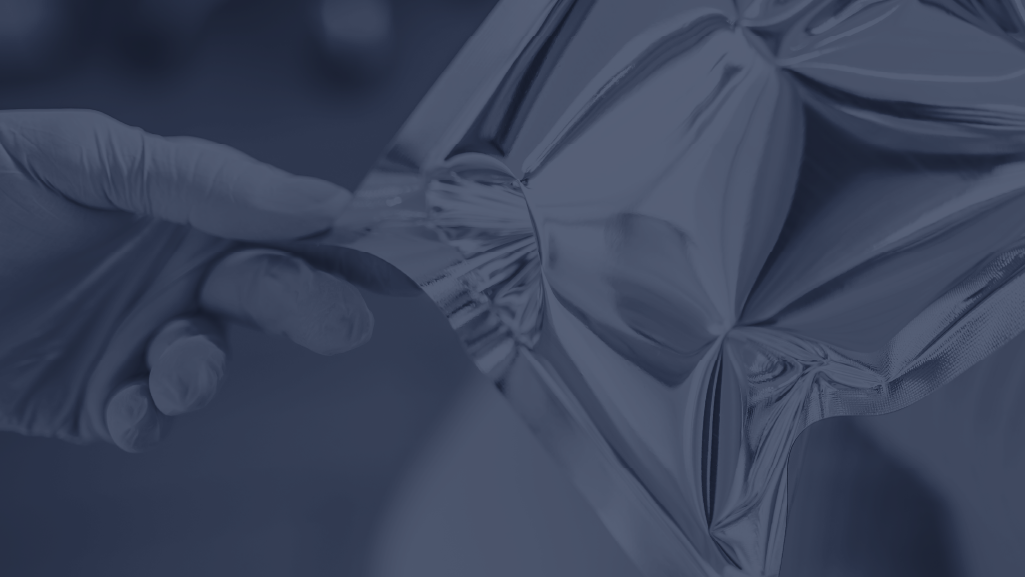 Medical device packages inside an environmental chamber for medical device shelf life validation testing under controlled temperature and humidity conditions.